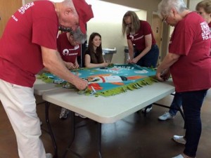 United Fort Myers volunteers finishing up the last no-sew blanket.